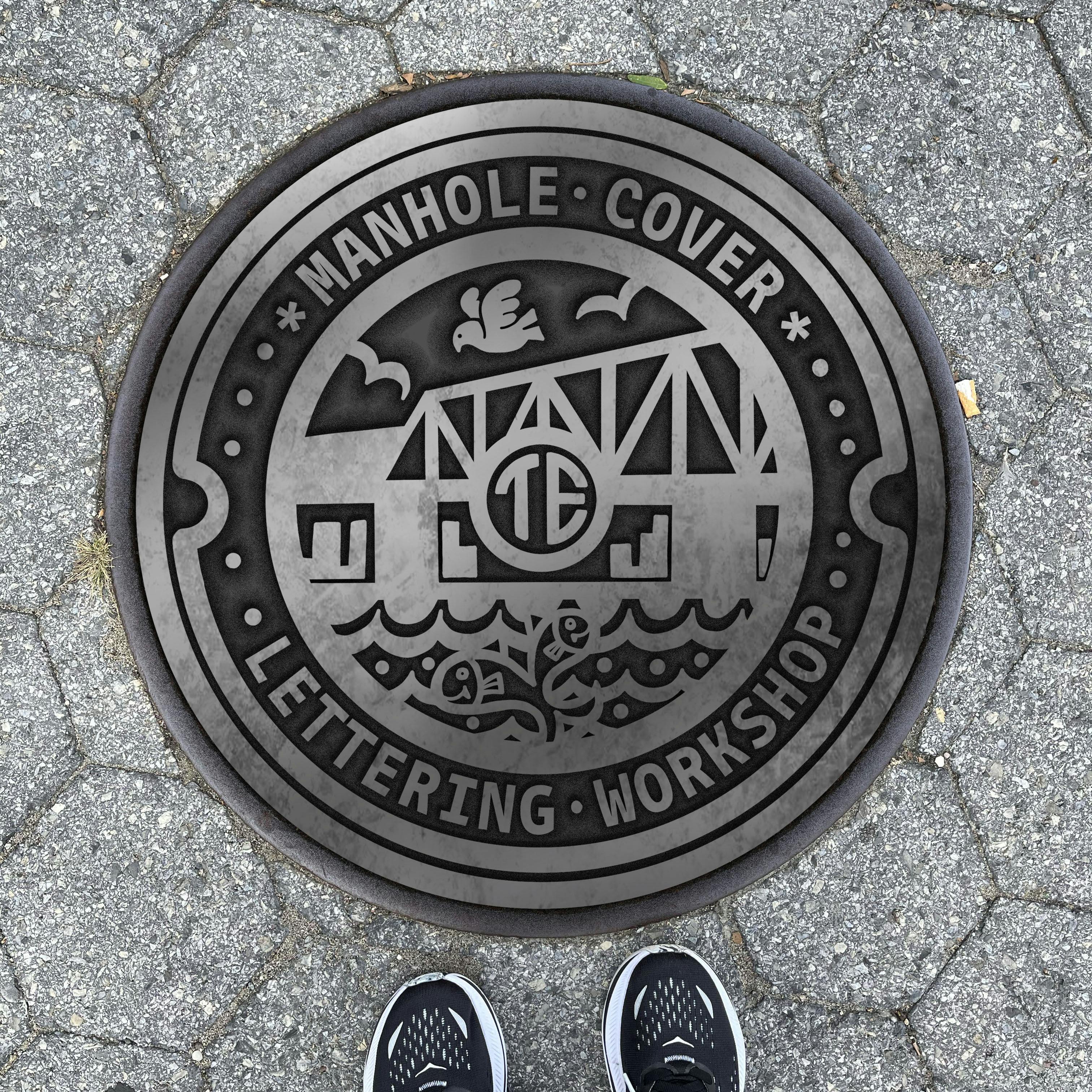 A street floor that has a manhole cover with letters that say "manhole cover lettering workshop" with images of gowanus, brooklyn